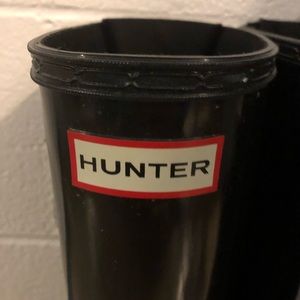 Tall black glossy Hunter rain boots